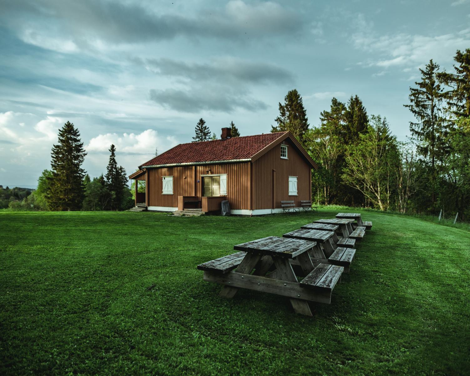 A rural home surrounded by open green space and trees, representing the Rural Housing Service in Texas and affordable homeownership opportunities in eligible rural communities.
