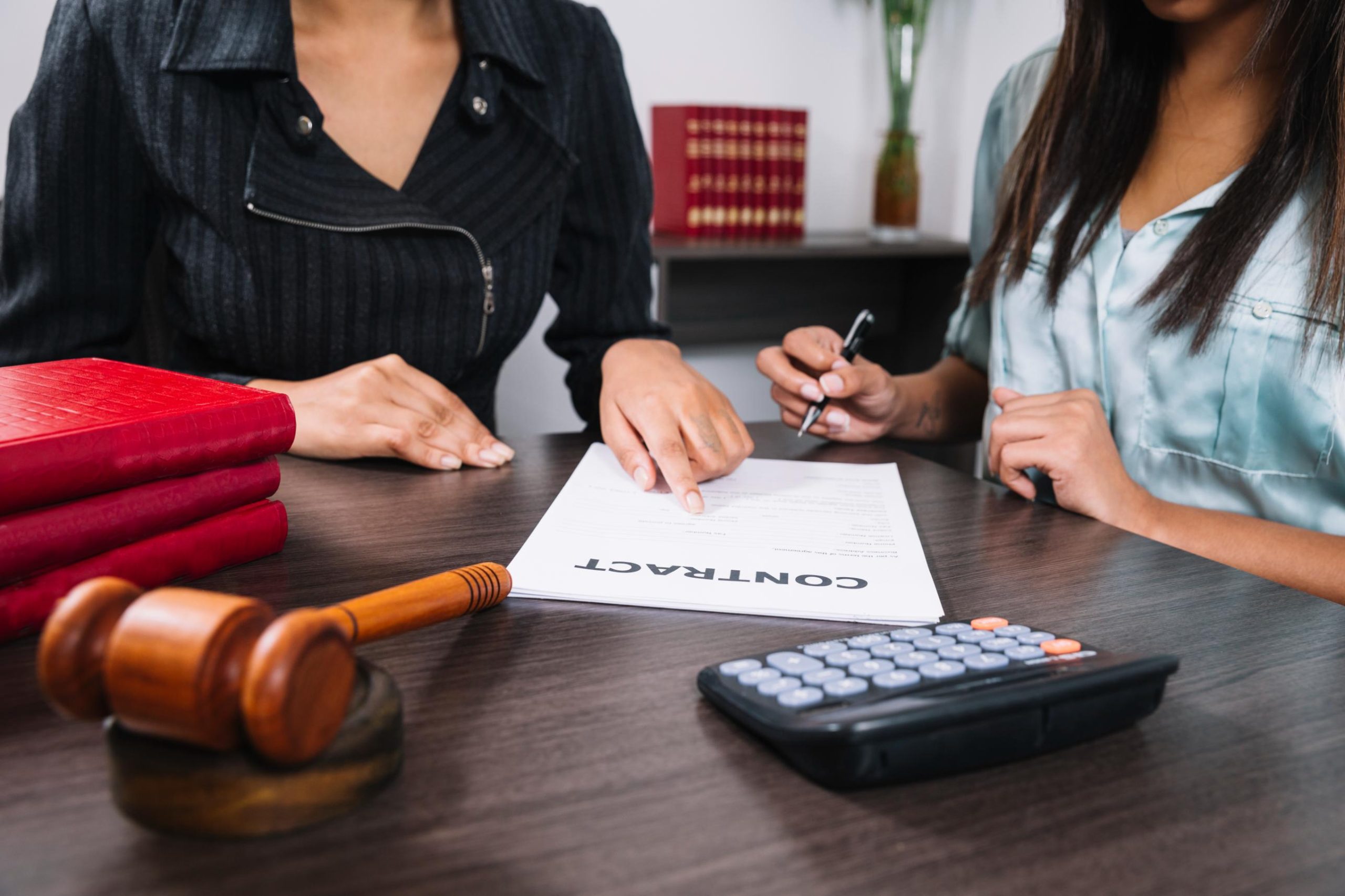 Homeowner reviewing foreclosure documents with a legal advisor, discussing Texas foreclosure laws and homeowner rights.