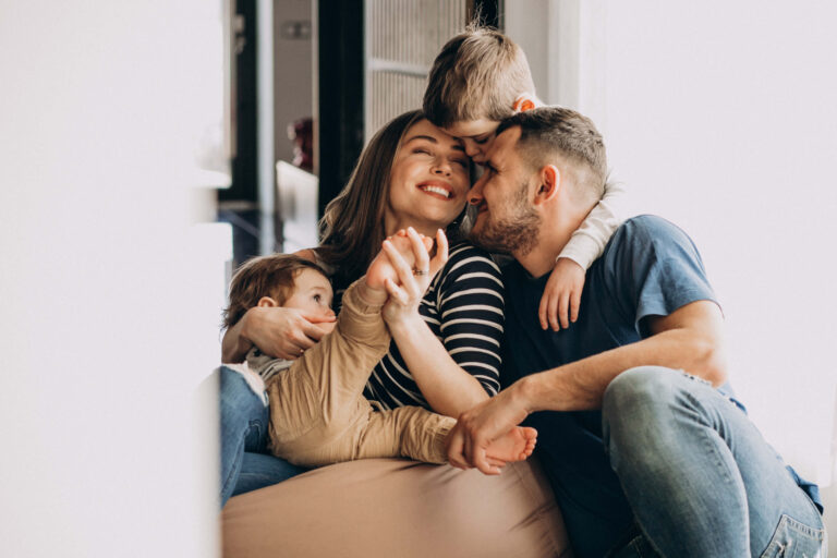 Young family having fun together at home after a successful home loan refinance in Texas.