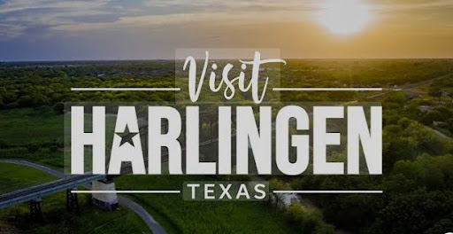 Visit Harlingen Texas sign over sunset landscape promoting affordable home loans, refinancing options, and mortgage programs in Harlingen, TX.