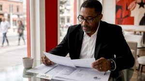 Mortgage analyst reviewing bond market reports