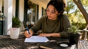 Young woman completing home loan application