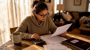 Homeowner reviewing mortgage refinancing papers