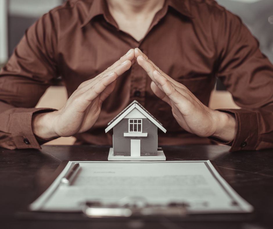 Homeowner protecting a house during Texas divorce while reviewing mortgage documents, refinance options, and community property laws.